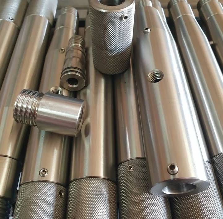 Batch of turned and knurled stainless steel shafts and bushes